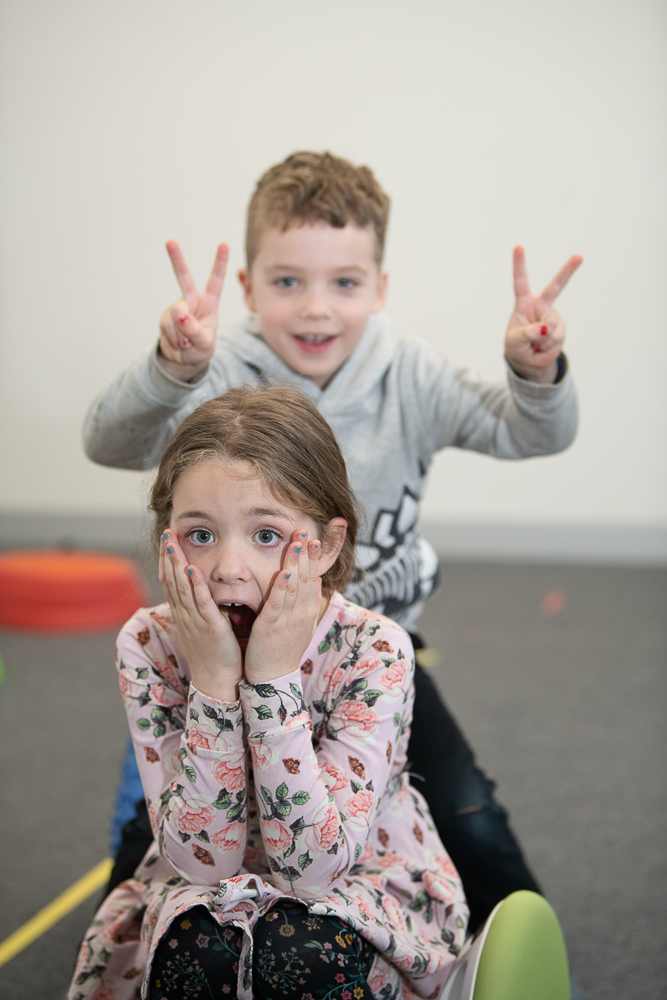 Two young children in a group OT session Melton